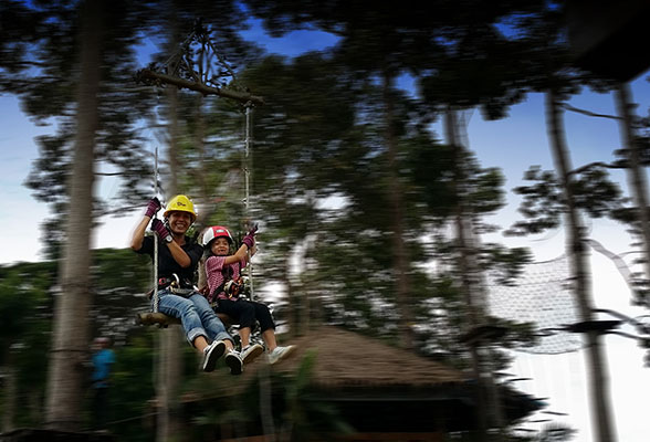 fly from treetop to treetop on a swing - Krabi Fun Park