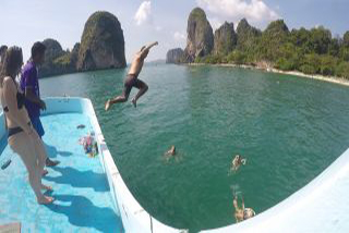 Jumping off the top level of the boat.